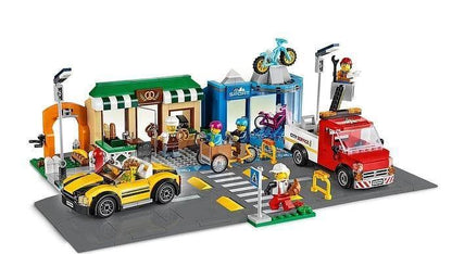 LEGO Winkelstraat met bakkerij, fietsenwinkel en park 60306 City Ville | 2TTOYS ✓ Official shop<br>